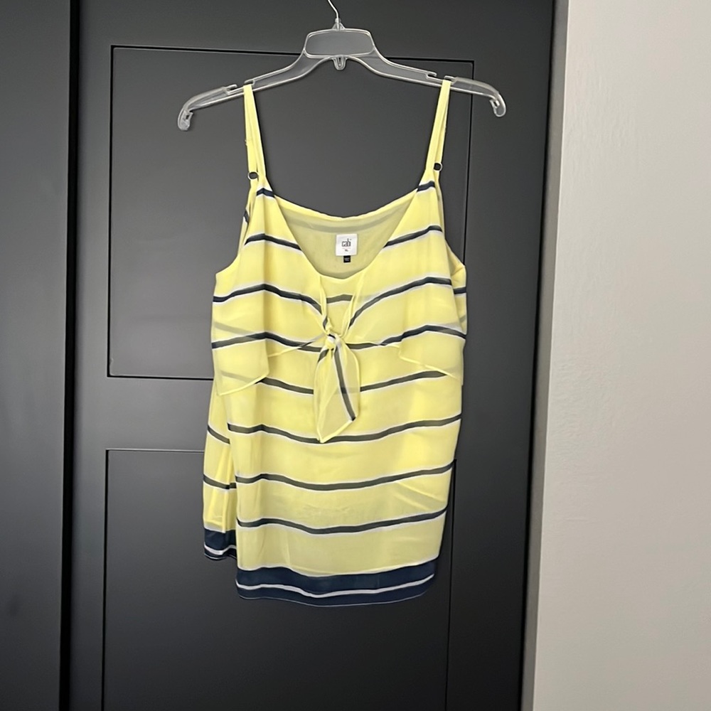 Yellow chiffon like material camisole top. Adjustable straps.